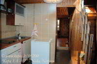 From the kitchen you also get into the sitting – room and the other premises of the cottage